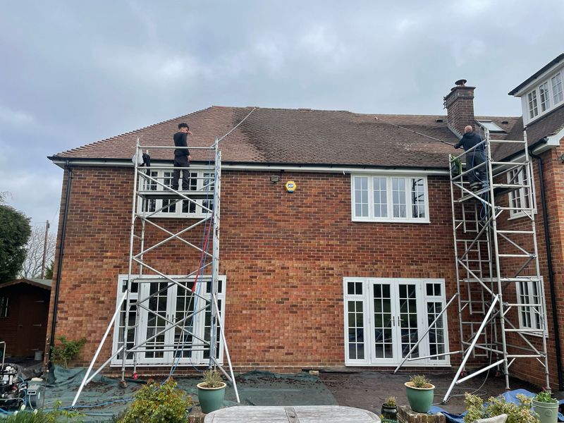 Roof cleaning carried out safely from scaffold towers by The Roof Moss Cleaners in Cranfield
